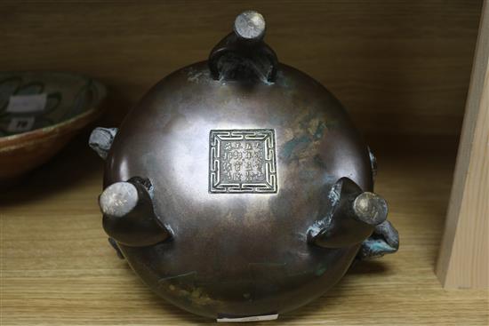 A Chinese bronze tripod censer